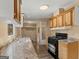 Functional kitchen featuring wood cabinets, modern appliances, and durable countertops at 351 Hemlock Ln, Locust Grove, GA 30248