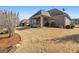 Large backyard with patio and brick exterior of the house at 409 Brandy Ln, Mcdonough, GA 30253