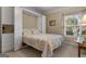 Cozy bedroom featuring a Murphy bed with a decorative floral pattern quilt and built-in storage at 409 Brandy Ln, Mcdonough, GA 30253