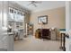 Bright bedroom with a large window, desk, craft supplies, and ample natural light at 409 Brandy Ln, Mcdonough, GA 30253