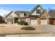 Charming exterior elevation of a home featuring brick, siding, and a well-manicured lawn at 409 Brandy Ln, Mcdonough, GA 30253