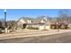 Charming brick home boasting a two-car garage, manicured landscaping, and a welcoming entrance at 409 Brandy Ln, Mcdonough, GA 30253