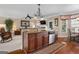Open-concept kitchen with an island, seamlessly connected to the living area at 409 Brandy Ln, Mcdonough, GA 30253