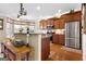 Well-appointed kitchen with stainless appliances, granite counters and custom cabinetry at 409 Brandy Ln, Mcdonough, GA 30253