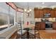 Bright breakfast nook with natural lighting, hardwood floors, and custom window treatments at 409 Brandy Ln, Mcdonough, GA 30253