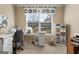 Functional office area with a large window for natural light, crafting space and a sewing machine at 409 Brandy Ln, Mcdonough, GA 30253