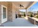 Covered patio showing a brick exterior with a ceiling fan at 409 Brandy Ln, Mcdonough, GA 30253