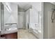 Bathroom with double sinks, granite counters, tiled shower, and tub at 540 Hamlet Dr, Hampton, GA 30228