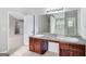 Bathroom featuring double sinks with granite counters and modern vanity at 540 Hamlet Dr, Hampton, GA 30228