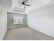Bedroom featuring neutral paint and carpet, a ceiling fan, and a window at 540 Hamlet Dr, Hampton, GA 30228
