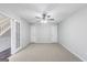 Spacious bedroom with carpet flooring and a staircase at 540 Hamlet Dr, Hampton, GA 30228