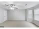 Large bedroom with carpet floors, ceiling fan and a large window at 540 Hamlet Dr, Hampton, GA 30228