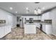 Modern kitchen with stainless steel appliances, granite countertops, island, and tiled backsplash at 540 Hamlet Dr, Hampton, GA 30228