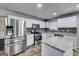 Updated kitchen features stainless appliances, granite countertops, and center island at 540 Hamlet Dr, Hampton, GA 30228