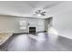 Spacious living room with a fireplace, large windows, and hardwood floors at 540 Hamlet Dr, Hampton, GA 30228