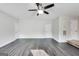 Large living room with multiple doors and an air vent on the wall at 540 Hamlet Dr, Hampton, GA 30228