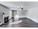Bright and airy living room with a fireplace and staircase, perfect for entertaining guests at 540 Hamlet Dr, Hampton, GA 30228