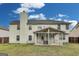 Exterior of the house features a screened porch, backyard and neutral siding at 540 Hamlet Dr, Hampton, GA 30228