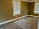 Comfortable bedroom with neutral carpeting, white trim and ample natural light at 4941 Old Atlanta Rd, Hampton, GA 30228