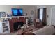 Cozy living room with a fireplace, mantel, and comfortable seating at 4941 Old Atlanta Rd, Hampton, GA 30228