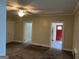 Spacious living room featuring multiple doorways and neutral color palette at 4941 Old Atlanta Rd, Hampton, GA 30228