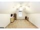 Large bonus room with carpet, sloped ceilings, and a ceiling fan at 1103 Larkspur Dr, Locust Grove, GA 30248