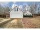 Charming single-Gathering home with a two-car garage and a cozy, landscaped front yard at 1103 Larkspur Dr, Locust Grove, GA 30248