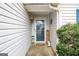 Charming front entrance with a welcoming door, seasonal decorations, and inviting curb appeal at 1103 Larkspur Dr, Locust Grove, GA 30248