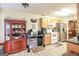 Bright kitchen featuring stainless steel appliances, wood cabinetry, and a tile floor at 1103 Larkspur Dr, Locust Grove, GA 30248