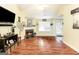 Bright living room with a cozy fireplace, hardwood floors, and plenty of natural light at 1103 Larkspur Dr, Locust Grove, GA 30248