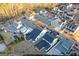 A high aerial view of the neighborhood features modern homes and a community pool at 1230 Hayes Sq, Peachtree City, GA 30269
