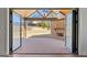 View of the back porch with stone fireplace and wood beam ceiling at 1230 Hayes Sq, Peachtree City, GA 30269