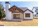 Spacious backyard with a covered patio, exposed rafter tails, and sliding glass doors at 1230 Hayes Sq, Peachtree City, GA 30269