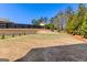 Spacious backyard with tiered retaining wall at 1230 Hayes Sq, Peachtree City, GA 30269