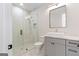 Bathroom features frameless glass shower, rectangular sink, and modern gray vanity at 1230 Hayes Sq, Peachtree City, GA 30269
