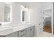 Bright bathroom features double vanity with vessel sinks, lighted mirrors, and modern fixtures at 1230 Hayes Sq, Peachtree City, GA 30269