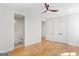 Bedroom with hardwood floors and ensuite bathroom offers a comfortable and inviting space at 1230 Hayes Sq, Peachtree City, GA 30269