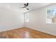 Bright bedroom features hardwood floors, and natural light from two windows at 1230 Hayes Sq, Peachtree City, GA 30269
