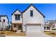 Charming two-story home featuring a white brick facade, wood accents and a two-car garage at 1230 Hayes Sq, Peachtree City, GA 30269