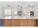 Spacious kitchen with a large island, stone countertops, and stainless steel appliances at 1230 Hayes Sq, Peachtree City, GA 30269