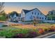 A street view features a row of modern homes with green landscaping and a fountain at 1230 Hayes Sq, Peachtree City, GA 30269