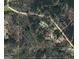 Aerial view of the property surrounded by trees at 575 Chuli Rd, Locust Grove, GA 30248