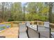 Enjoy outdoor dining on this spacious back deck with wooded view at 575 Chuli Rd, Locust Grove, GA 30248