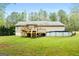 A large backyard with deck and above ground pool at 575 Chuli Rd, Locust Grove, GA 30248