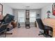 Bedroom featuring carpet flooring, lots of natural light and space for a home gym at 575 Chuli Rd, Locust Grove, GA 30248