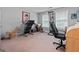 Bedroom featuring carpet flooring and two windows providing lots of natural light at 575 Chuli Rd, Locust Grove, GA 30248