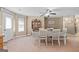 Dining area with table set for six, featuring a classic china cabinet and a cozy, inviting atmosphere at 575 Chuli Rd, Locust Grove, GA 30248