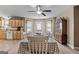 Cozy dining room featuring a ceiling fan, a table set for six, and a classic hutch display at 575 Chuli Rd, Locust Grove, GA 30248