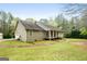 Charming home on large lot with a covered front porch and attached garage at 575 Chuli Rd, Locust Grove, GA 30248