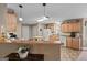 Functional kitchen with a breakfast bar, white appliances, and wood cabinets offering ample storage at 575 Chuli Rd, Locust Grove, GA 30248
